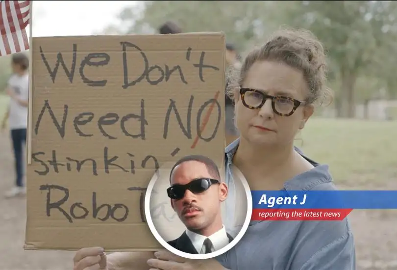 Agent J reports on the protests against Tesla's upcoming robotaxi launch in Austin, where safety concerns and political gripes collide.