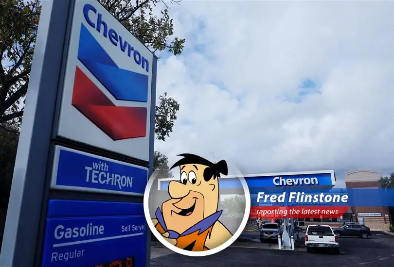 Fred Flinstone reports on Chevron's slowing share buybacks due to falling crude prices, leaving even a Bedrock boy feeling the pinch.