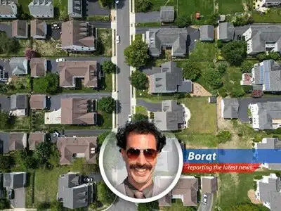 Borat reports on how falling mortgage rates are making homeowners happier than seeing Pamela Anderson on a beach, but new home buyers still have 'tsuris'. image