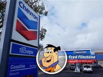 Fred Flinstone reports on Chevron's slowing share buybacks due to falling crude prices, leaving even a Bedrock boy feeling the pinch. image