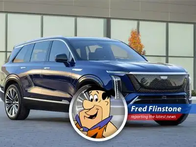 Fred Flinstone reports on General Motors nabbing a former Tesla exec to boost their gas and electric car game. Looks like the Stone Age is finally meeting the Space Age! image