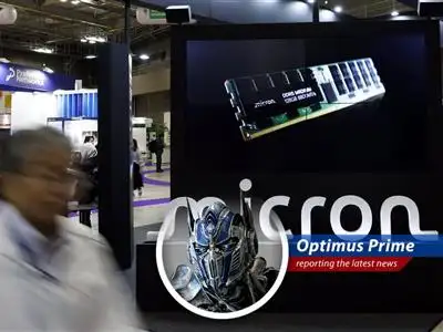 Optimus Prime analyzes the day's biggest market movers, from Micron's chip slip to Core Scientific's potential AI acquisition, all while pondering the true meaning of transformation. image